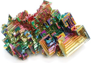 a bismuth crystal displayed on a white background