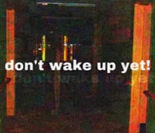 oversaturated image of a hallway in an abandoned building. text across it reads "dont wake up yet!"