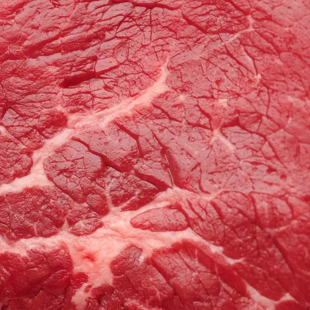 closeup picture of a piece of raw red meat