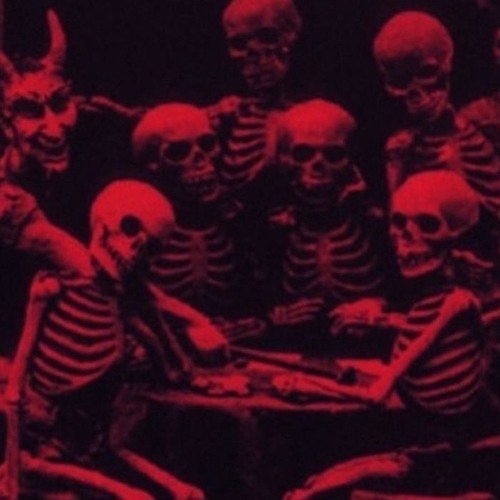 picture of several skeletons, some horned, all sitting around a table